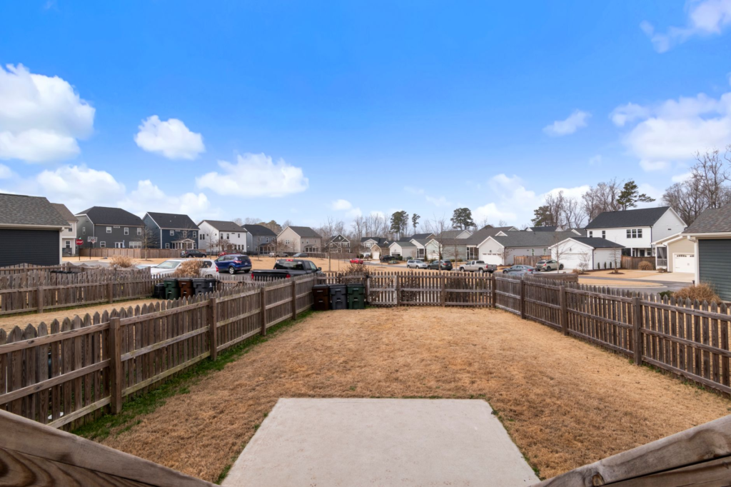 Suburban backyard with fencing, typical of properties suited to a detached ADU